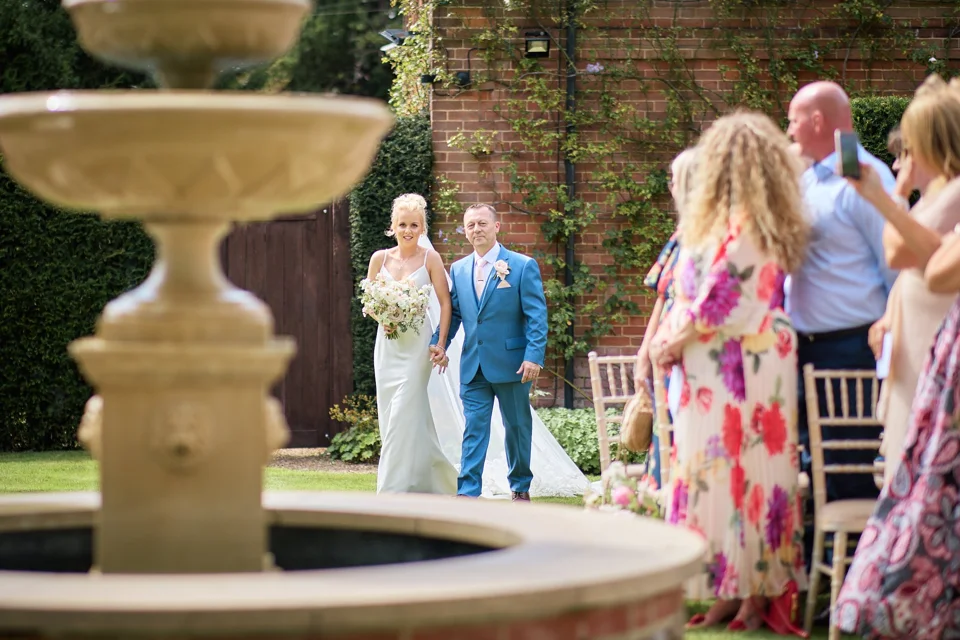 The bride being escorted outside