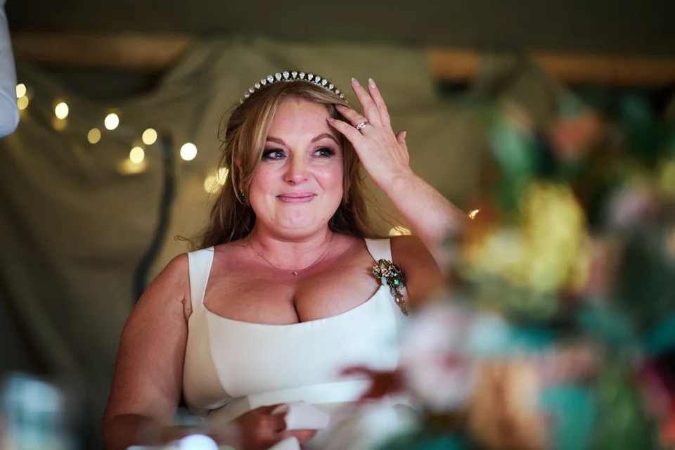 The bride listening during the speeches